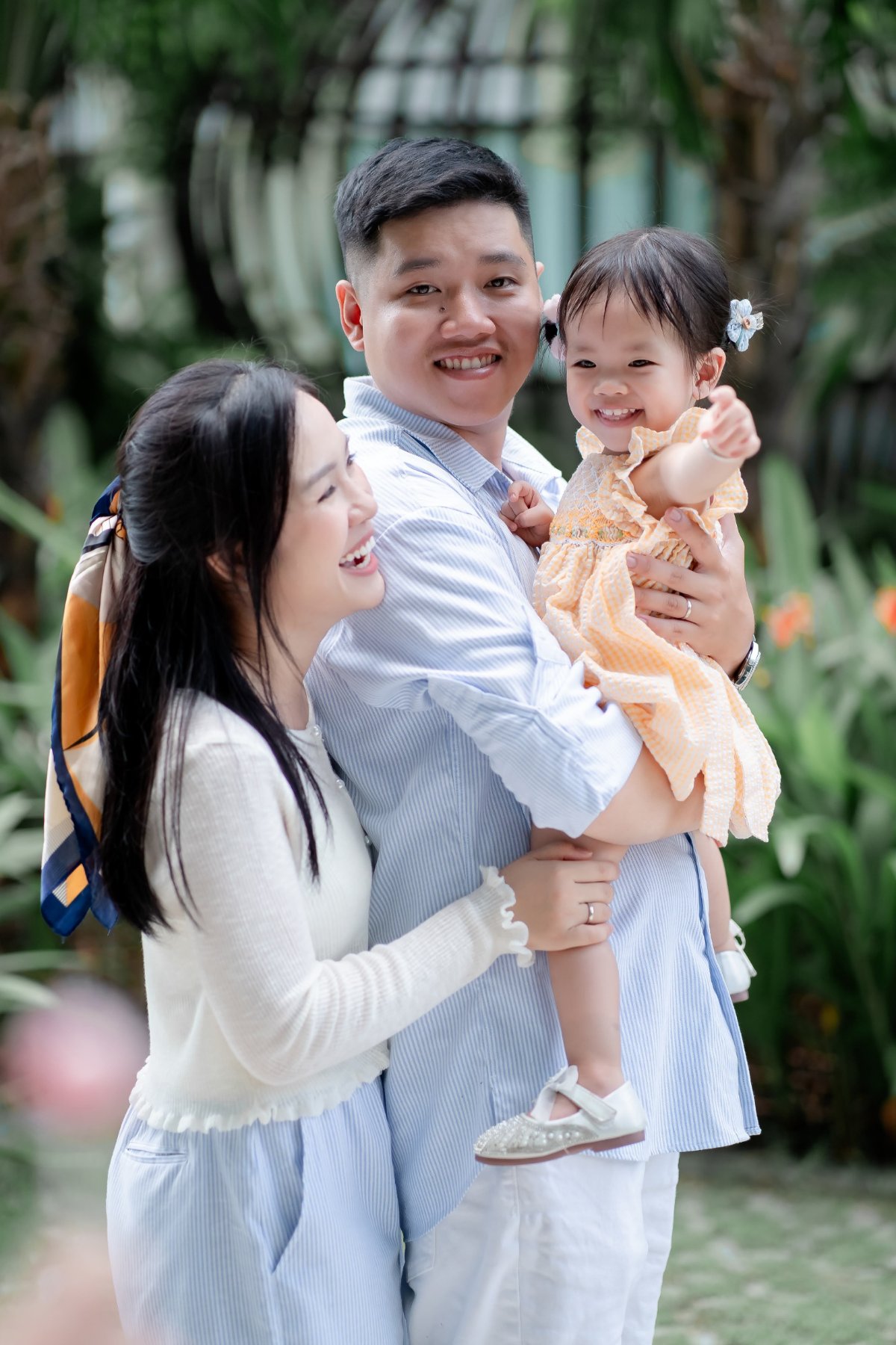 Family standing together in a garden